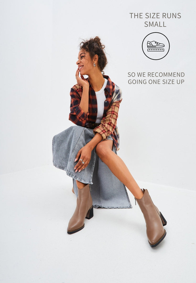 A pair of stylish brown leather women's ankle boots, perfect for both casual and stylish looks.