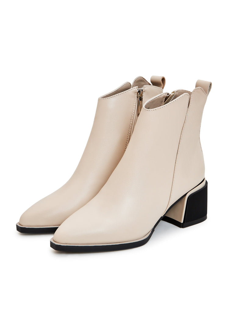A stylish pair of comfortable beige ankle boots for women, perfect for a casual and fashionable look.