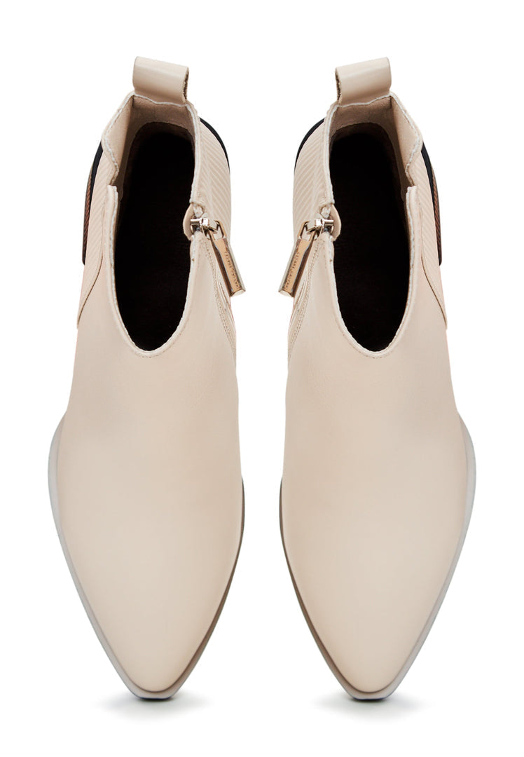 A stylish pair of women's beige casual ankle boots - fashionable and comfortable for everyday wear.