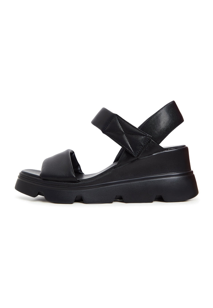 A trendy pair of leather platform sandals perfect for the urban fashionista.
