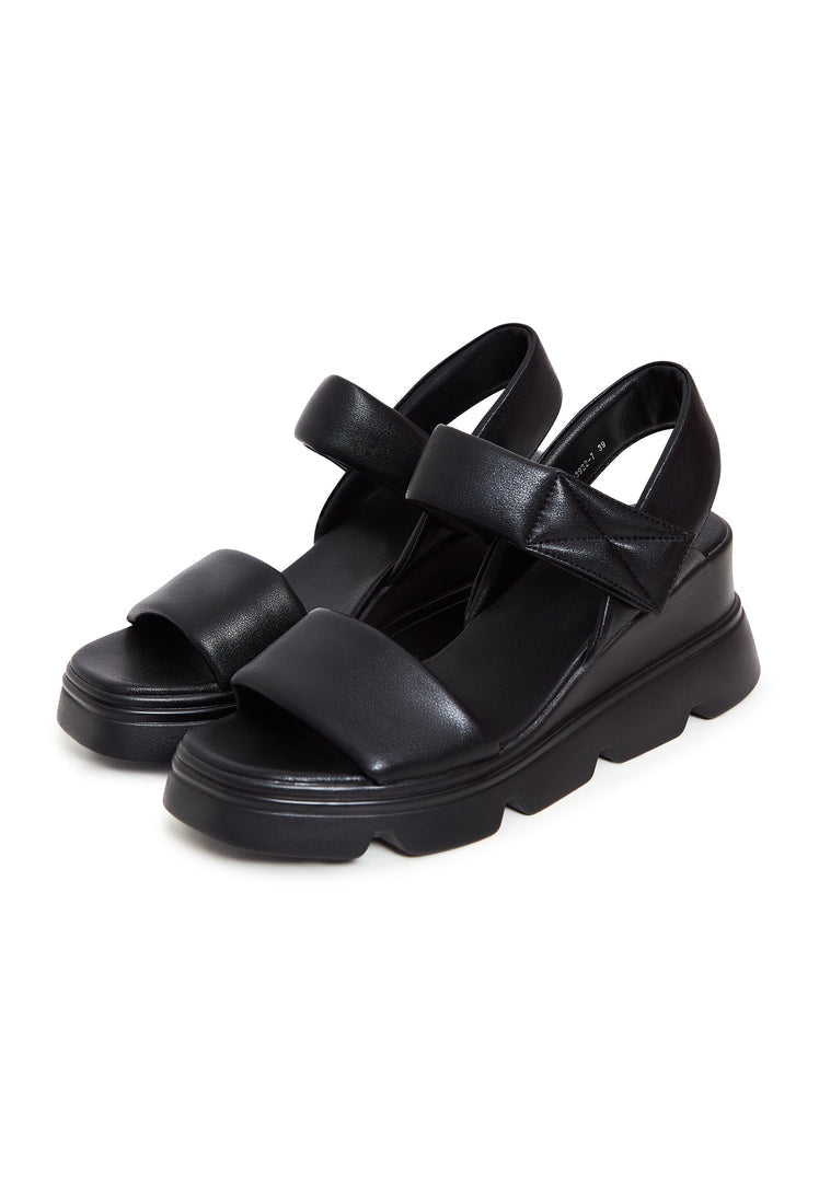 A stylish pair of urban leather platform sandals perfect for adding a touch of chic and comfort to your outfit.