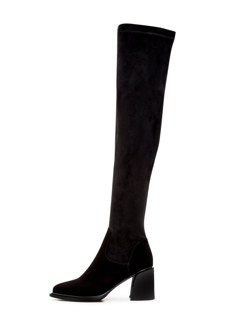 A pair of daring leather stiletto boots, the ultimate high heel women's fashion footwear for a trendy look.