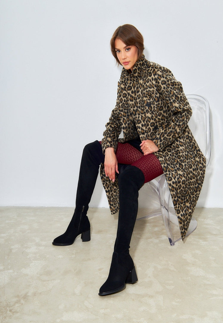 A pair of stylish leather stiletto boots, perfect for the daring woman who loves high heels and trendy footwear in women's fashion.