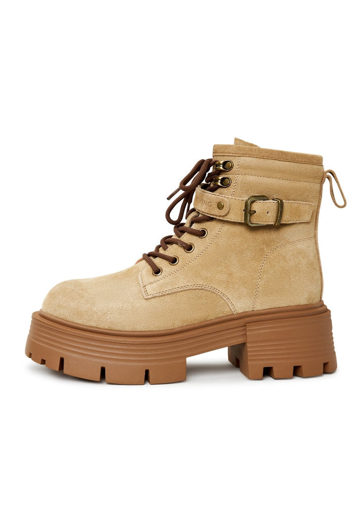 A pair of elegant beige platform ankle boots, the epitome of stylish women's fashion footwear.