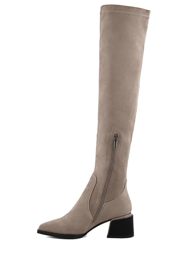 A pair of chic beige suede over-the-knee boots, the ultimate fashion footwear statement.