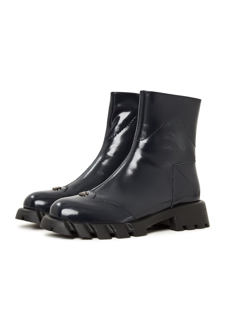 Fashionable blue leather ankle boots with a trendy flat sole design for women.