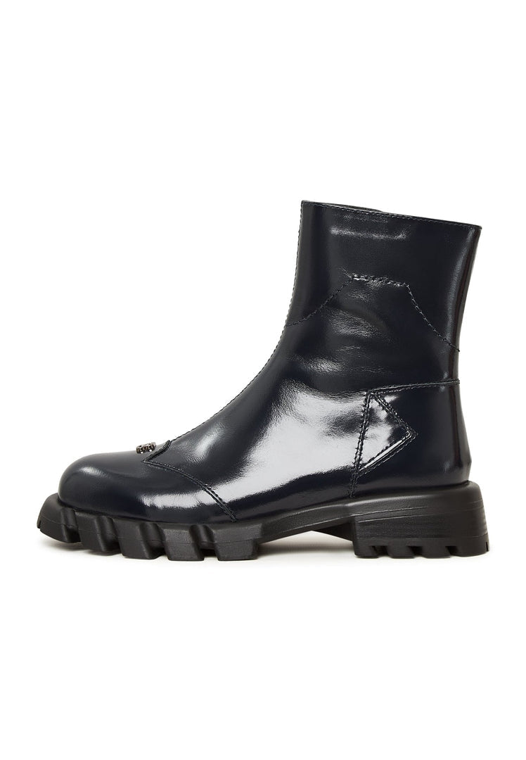 A stylish pair of women's blue leather ankle boots with a trendy flat sole design.