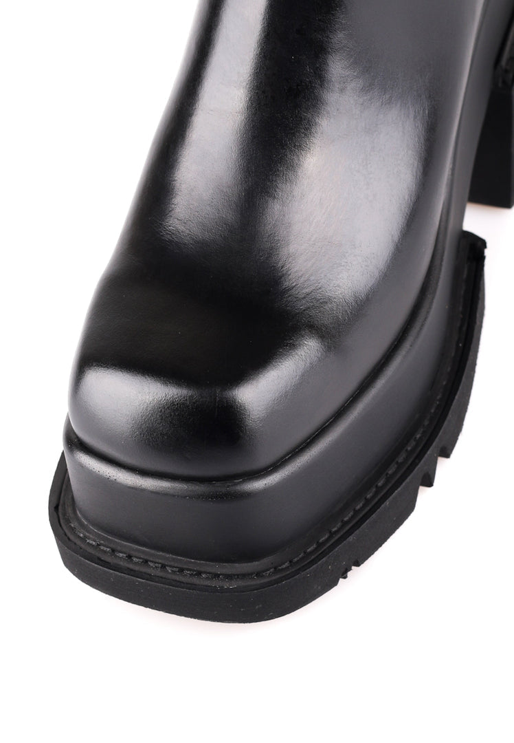 A stylish pair of chunky platform leather ankle boots, the perfect choice for women looking for trendy and comfortable footwear.