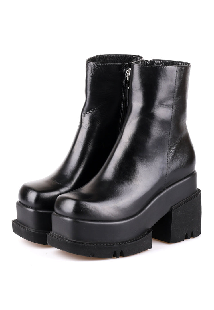 A close-up image of chunky platform leather ankle boots, stylish and trendy ankle boots for women.