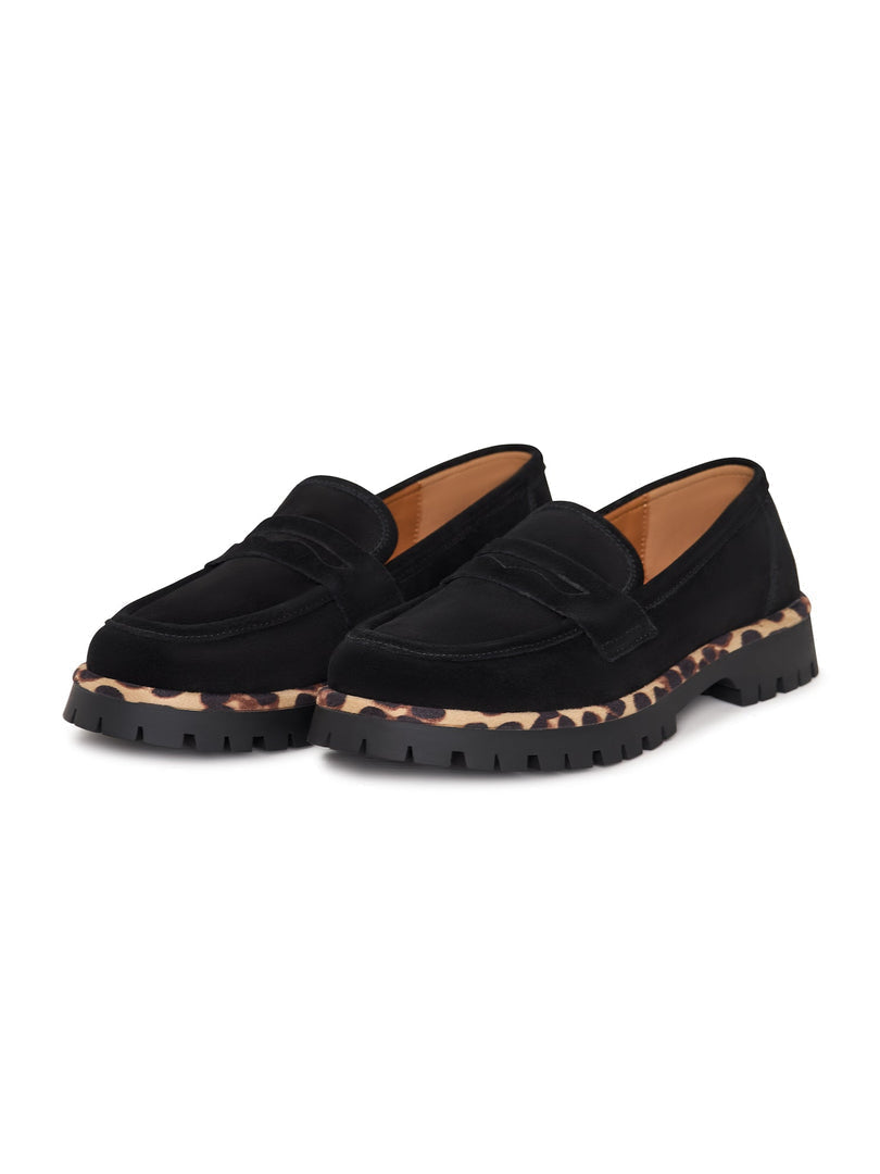 A pair of Lily black loafers, featuring a chunky sole design that adds a stylish touch to this chic and fashionable footwear.