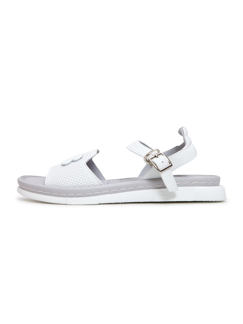 A stylish woman wearing trendy white urban platform sandals, a perfect choice for a fashionable and chic summer look.