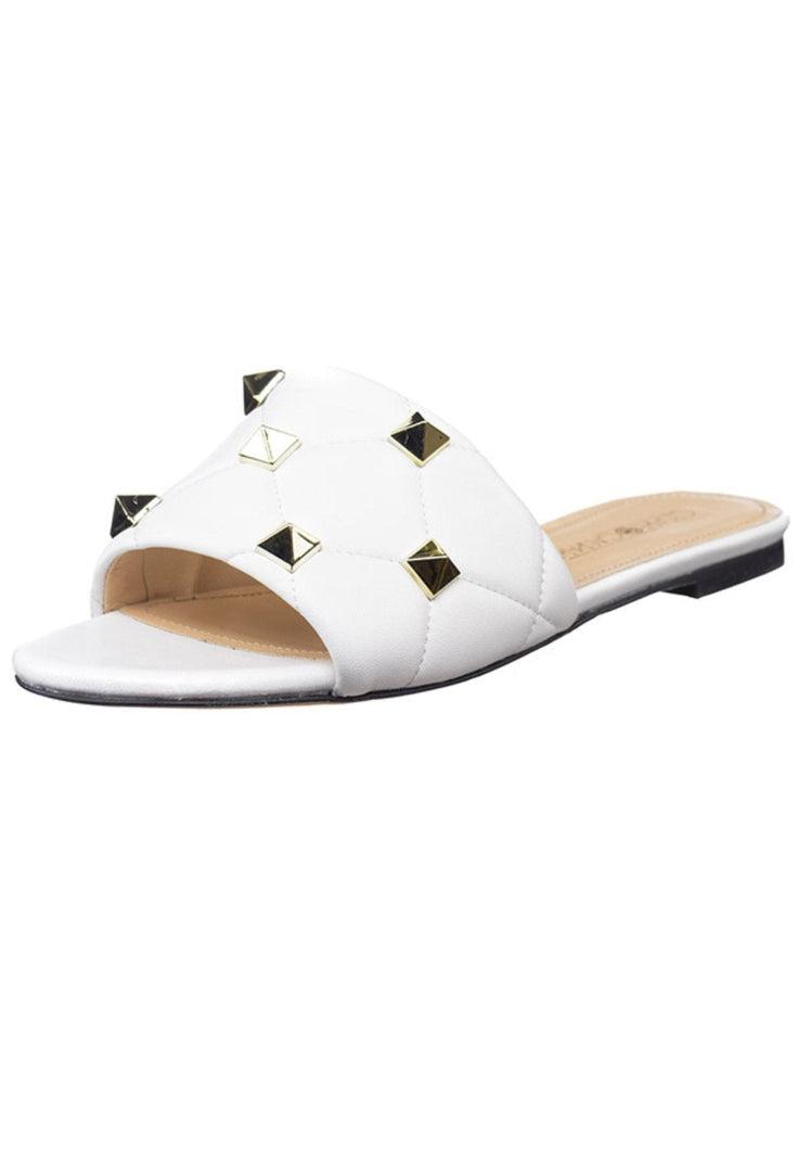 A close-up image of white Rockstud and Mila sandals.
