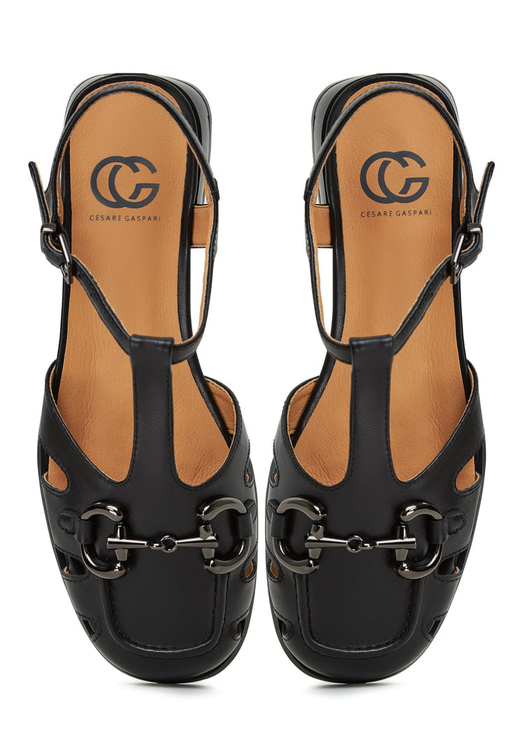 A pair of black Aisha flat sole sandals, perfect for summer, are fashionable and comfortable women's sandals.