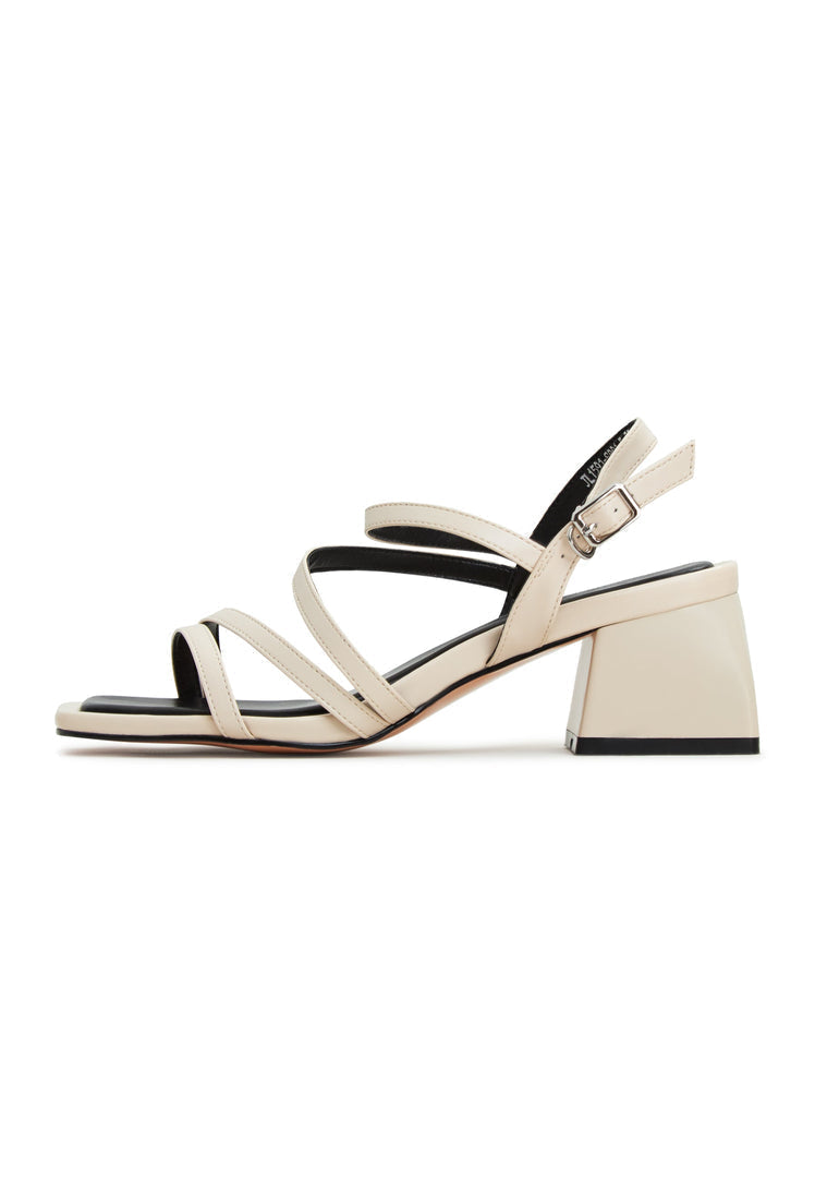 A pair of elegant beige block heels sandals known as Maria sandals, a fashionable choice for women's summer footwear.