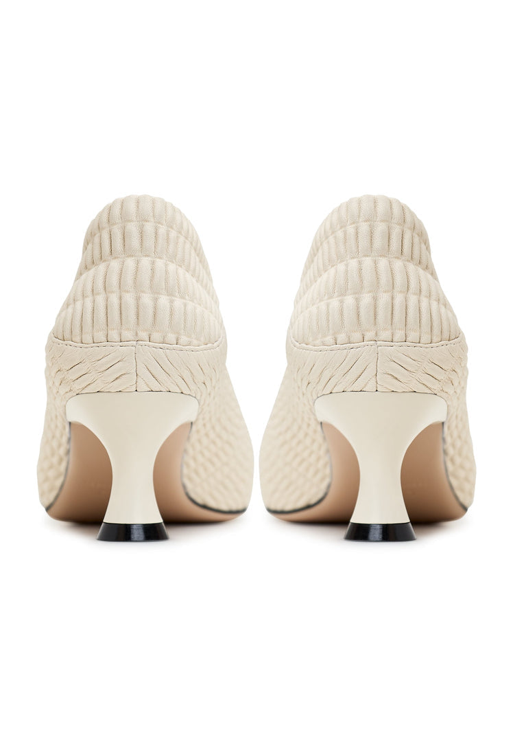 A stylish pair of white high heel pumps, known as Carol pumps, perfect for women's fashion, featuring designer stiletto heels.
