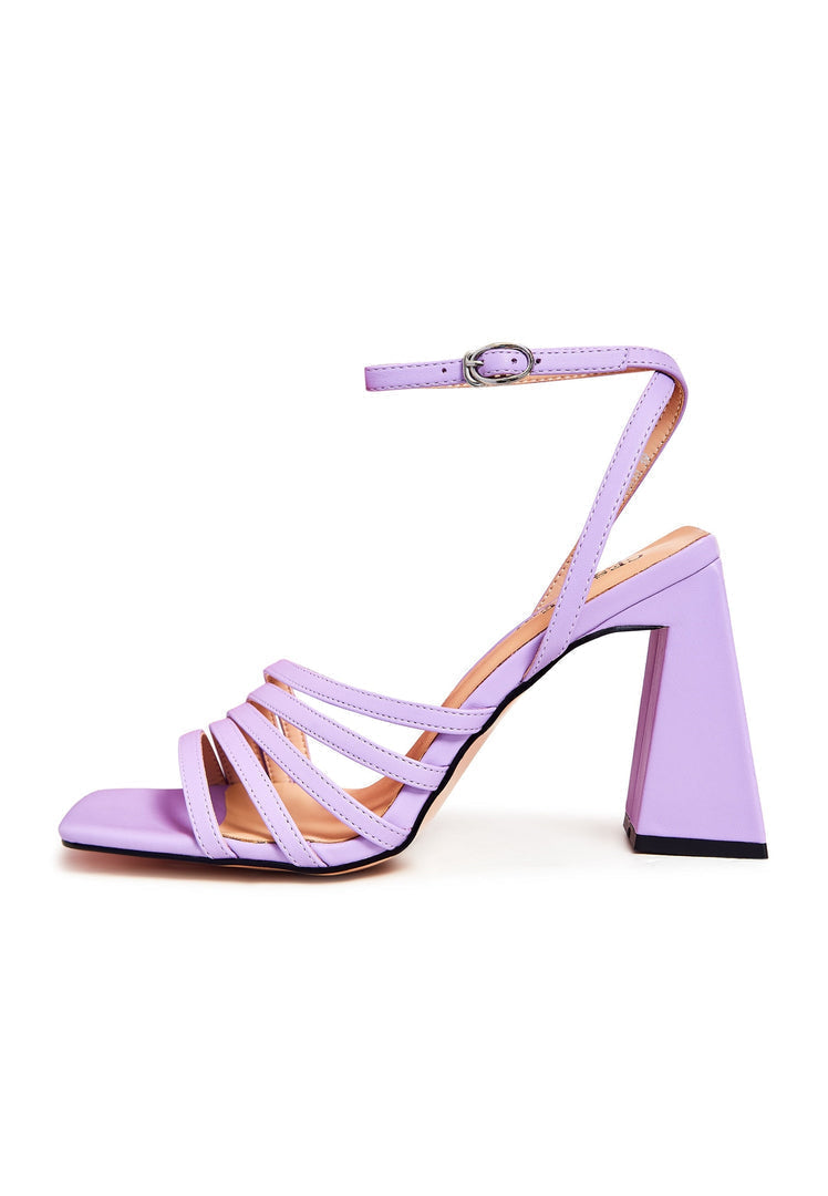 A pair of trendy women's chunky comfort sandals in a vibrant violet color, perfect for chic and comfortable summer footwear.
