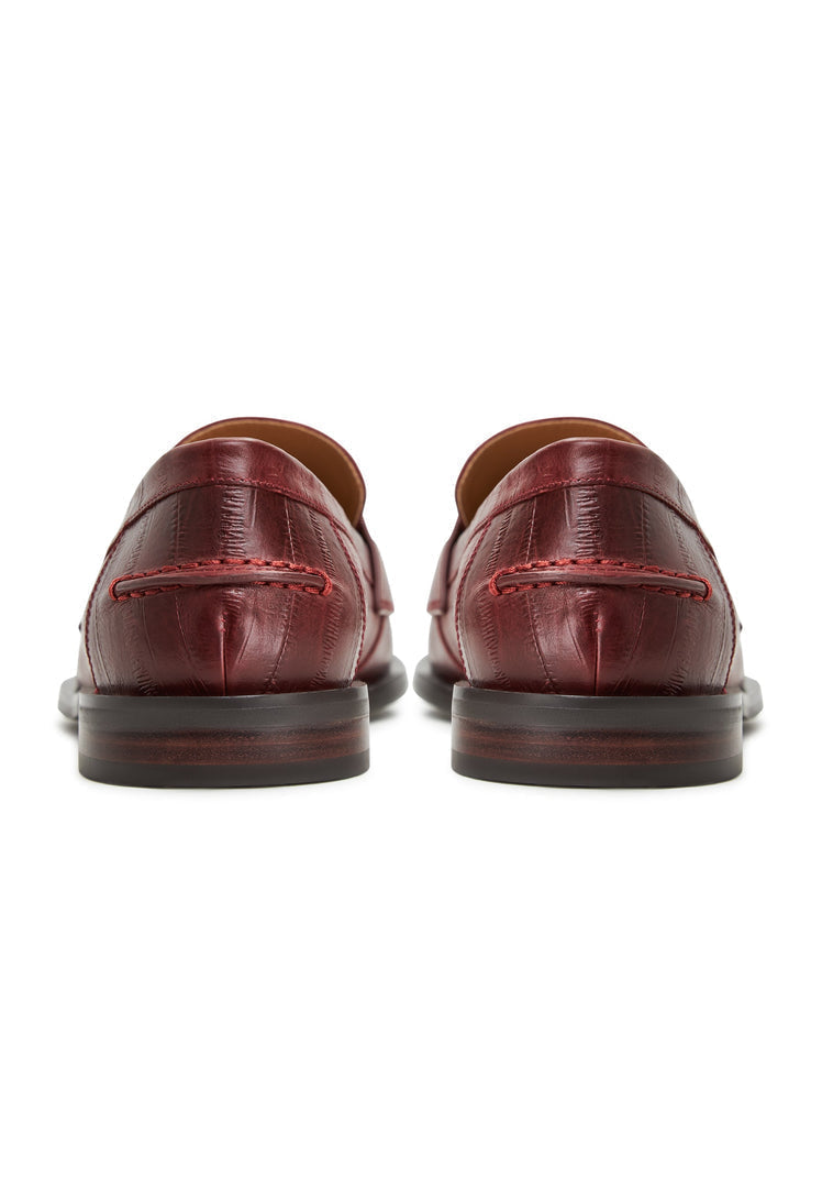 A chic selection of women's loafers and block-heeled shoes in luxurious leather and trendy Bordeaux colors, perfect for any fashionista's shoe collection.