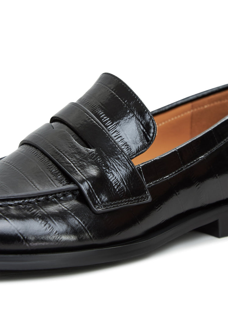 A stylish pair of black leather block heeled loafers for women - the perfect blend of sophistication and comfort.
