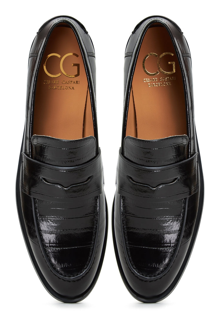 A fashionable pair of black leather block heeled loafers for women - a versatile and stylish addition to your collection of leather shoes.