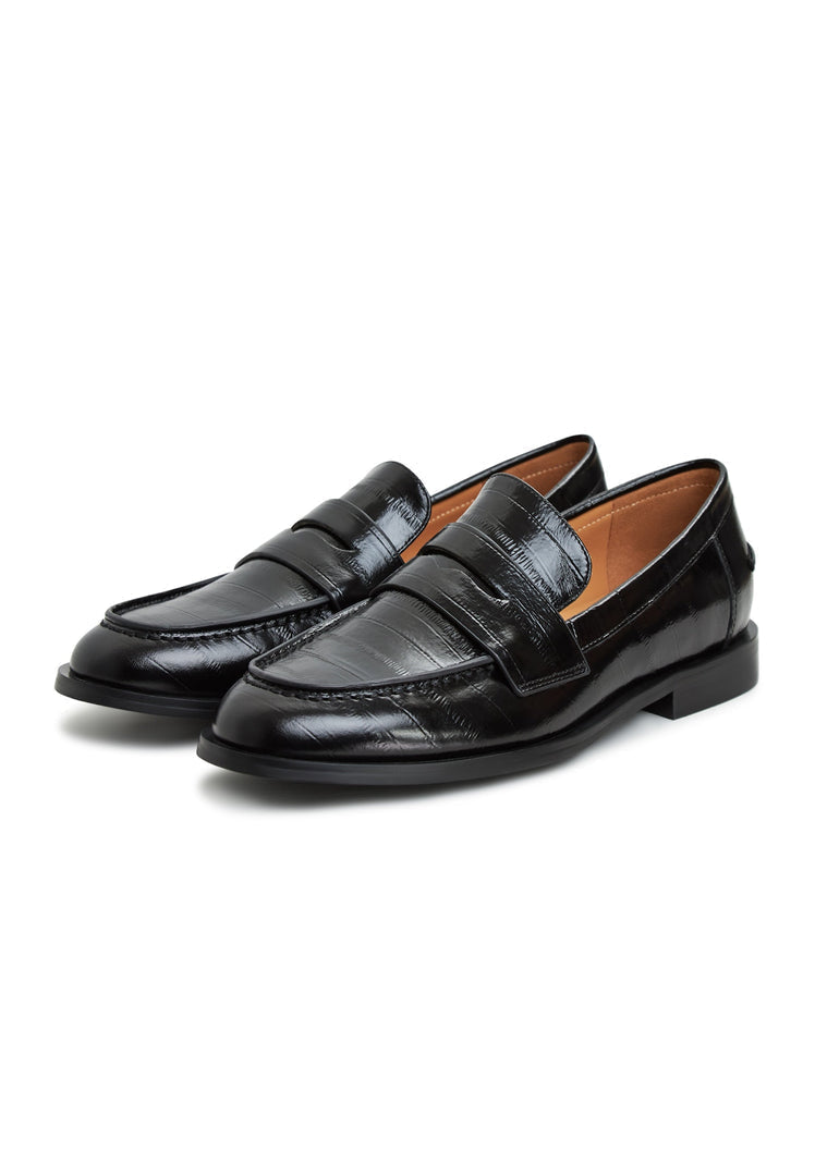 A stylish pair of black leather block heeled loafers, perfect for women looking for comfortable and chic leather shoes.