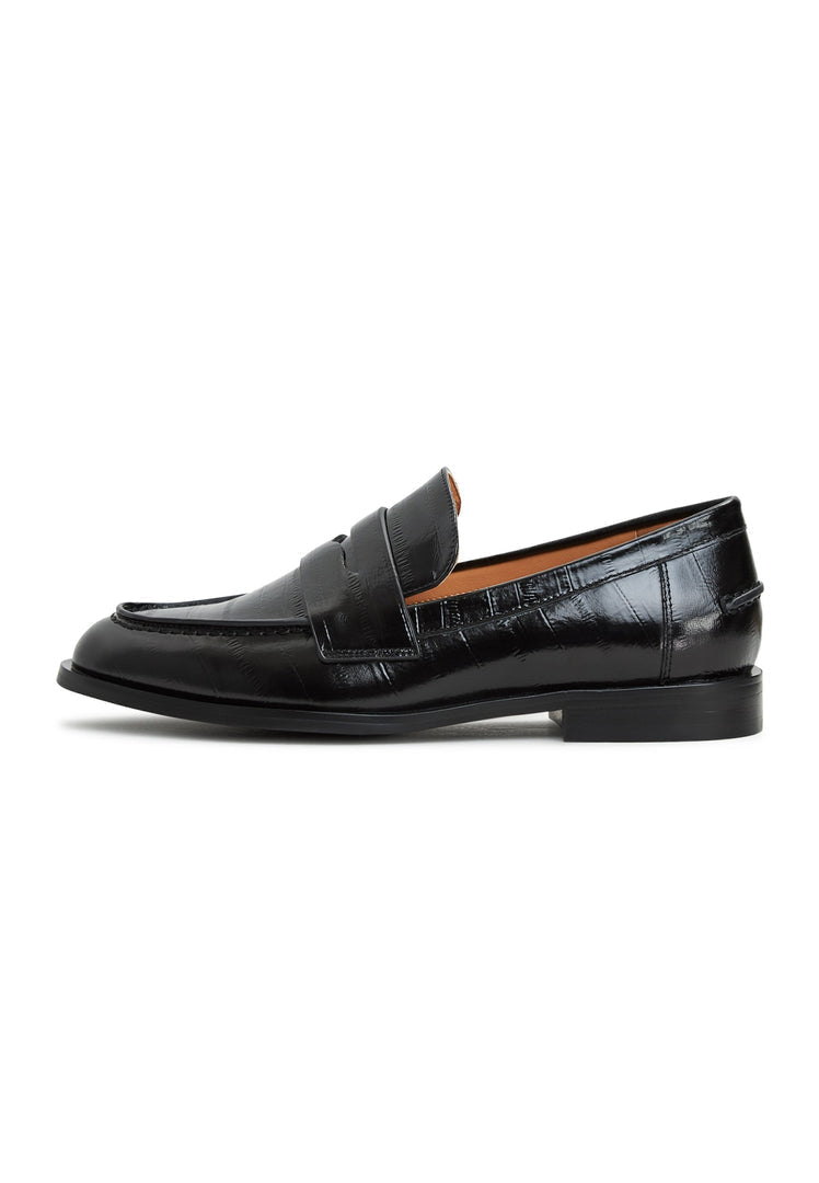 A stylish pair of black leather block heeled loafers, perfect for women looking for chic and comfortable leather shoes.