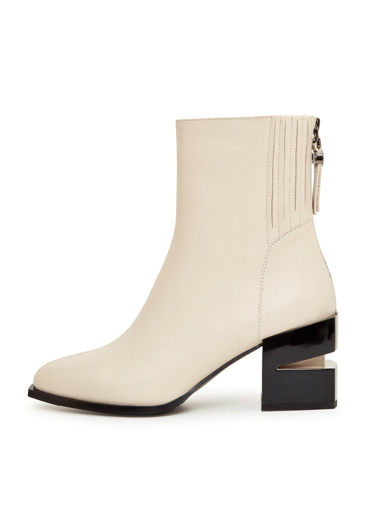 A stylish pair of women's beige leather ankle boots with a chunky block heel, perfect for fashionable footwear.
