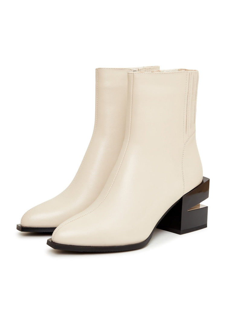 A stylish pair of women's leather ankle boots with a chic block heel design in beige, perfect for fashion-forward individuals looking for trendy footwear.