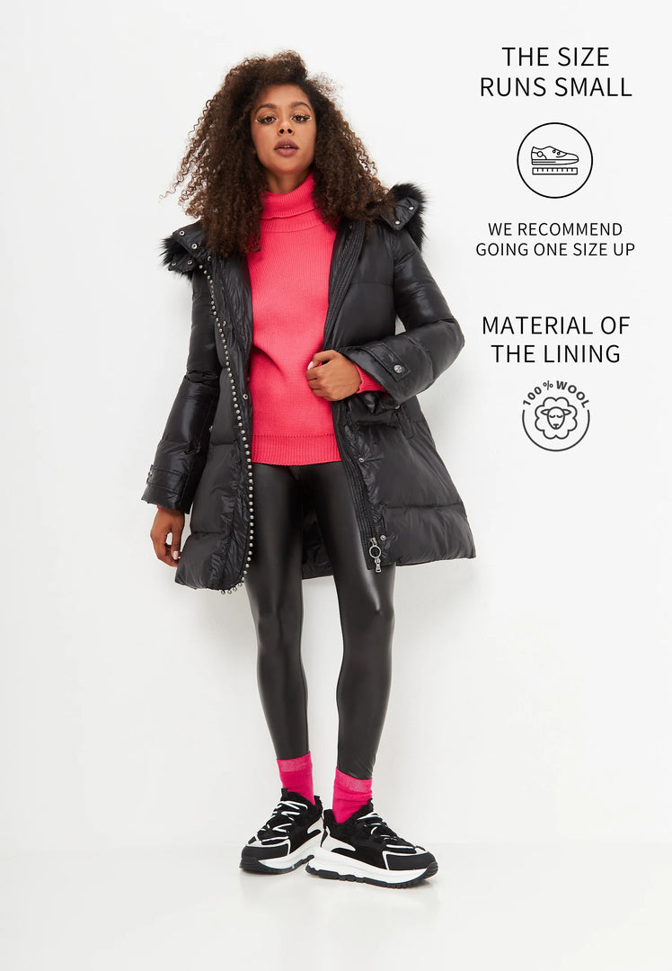 A pair of stylish black platform sneakers, perfect for the winter season. These warm and trendy fashion footwear are a must-have in any wardrobe.