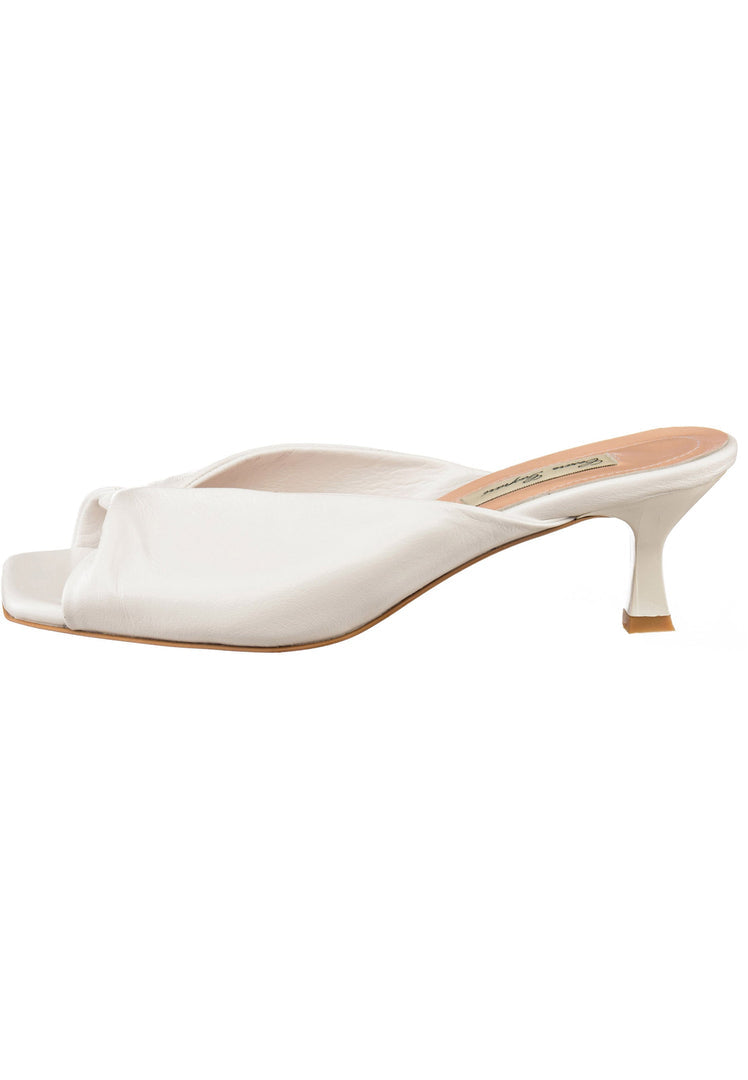 Elevate your style with these chic white twist luxe heels featuring a unique twist design, perfect for any fashion-forward look.