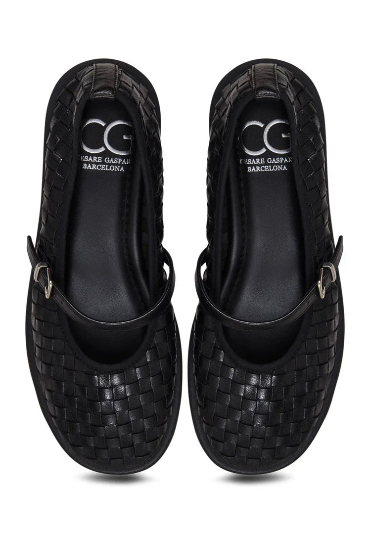 A pair of black Woven Elegance Mary Janes, stylish women's shoes that combine fashion and elegance perfectly.