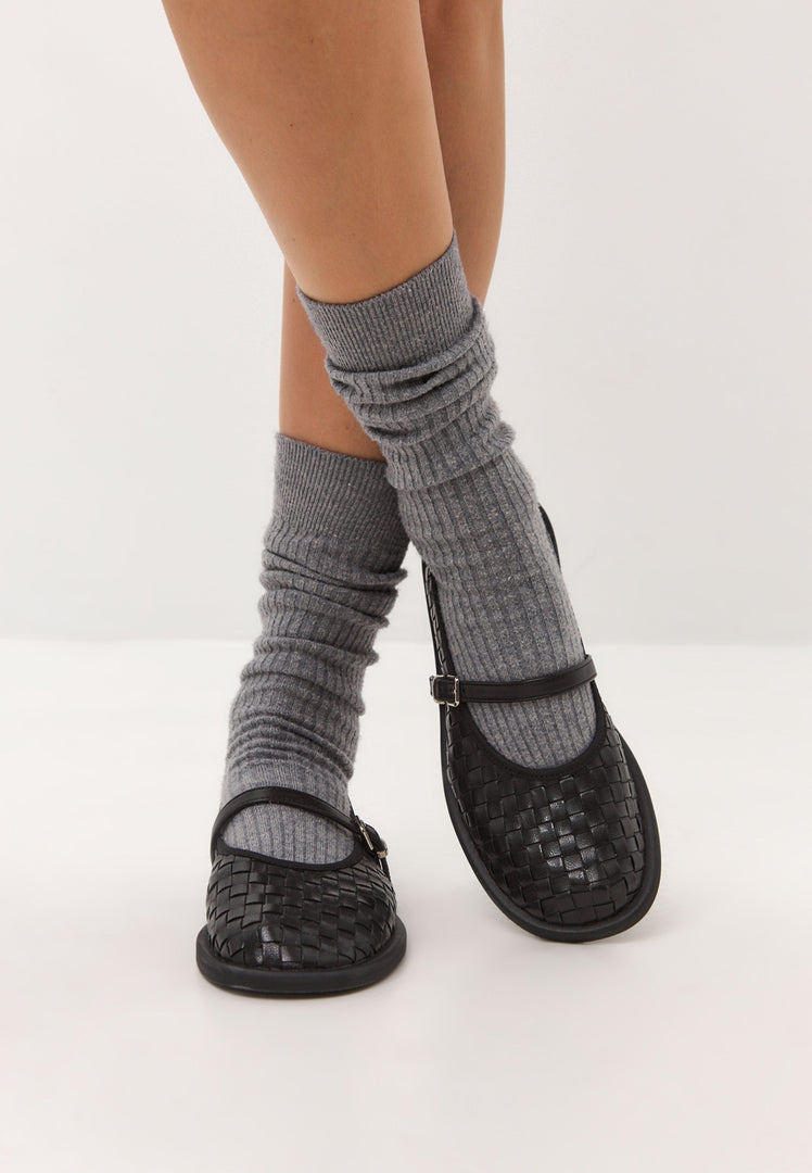 A fashionable and elegant pair of black Women's Mary Janes with a unique woven design - perfect for adding a touch of style to any outfit.