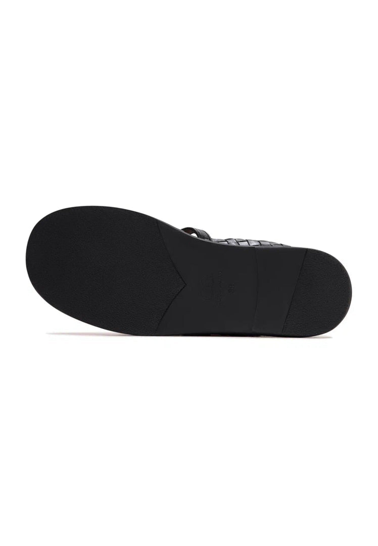 A pair of black Women's Mary Janes with woven elegance design, perfect for adding a fashion-forward touch to any outfit.