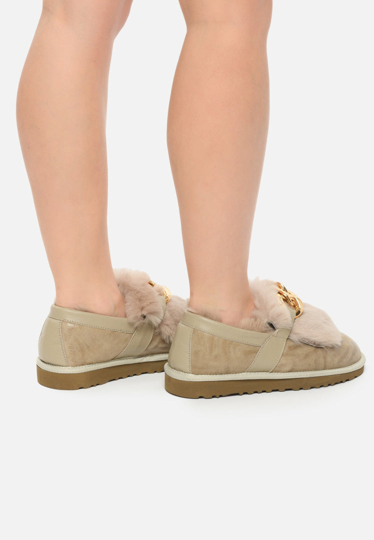 A stylish pair of beige women's chain fur lined loafers, perfect for any occasion - a must-have item for your designer shoe collection.