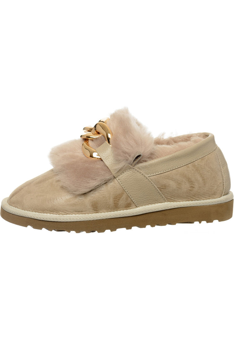 A stylish pair of beige fur lined loafers for women, perfect for any outfit.