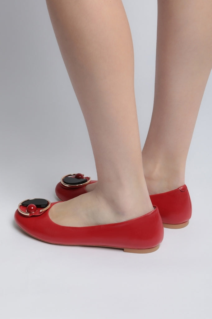 A stylish pair of modern geometric red ballet flats, perfect for making a statement with your footwear.