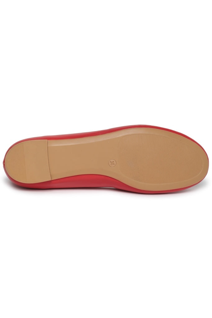 A close-up image of modern geometric red ballet flats, showcasing intricate geometric patterns on stylish red shoes.