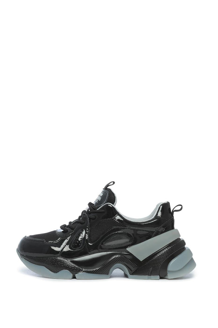 A pair of trendy fashion sneakers with a chunky sole and glossy finish, perfect for adding some height and style with platform design.