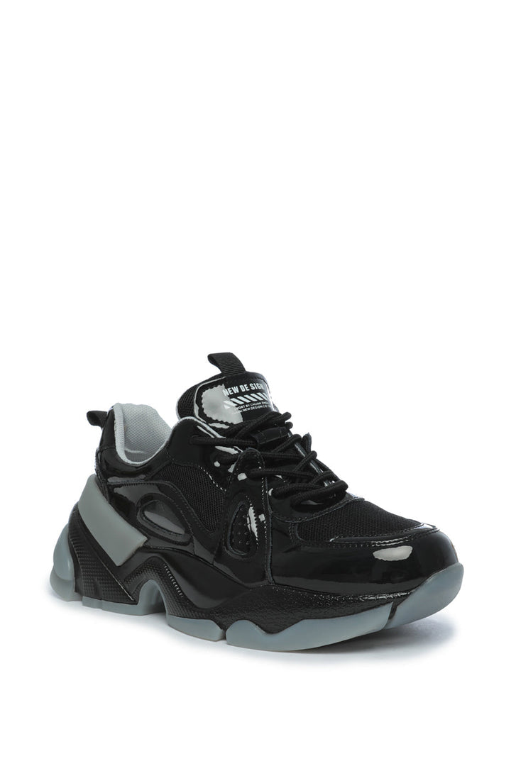 A stylish pair of chunky sole platform sneakers with a glossy finish, perfect for anyone looking to stay fashionable and on-trend.