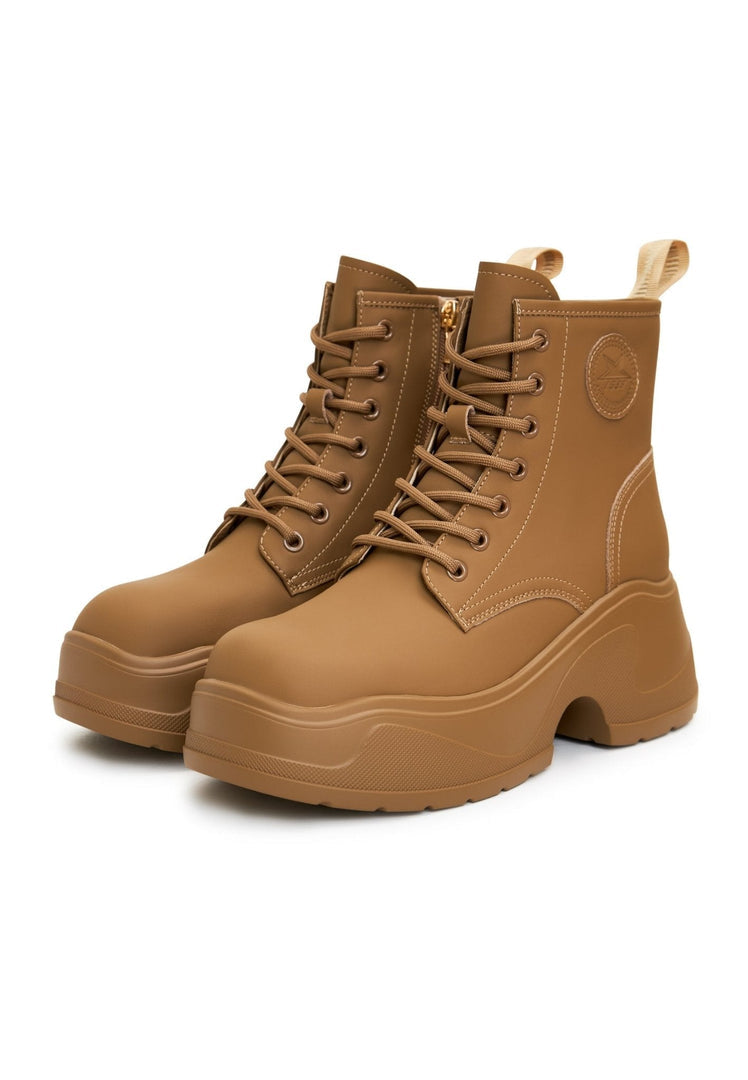 A stylish pair of beige platform ankle boots for women - the perfect fashion boots for designer footwear lovers.