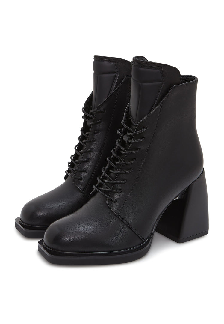 A stylish pair of black leather lace-up ankle boots, also known as Behati black boots, featuring a sleek and fashionable design perfect for any outfit.