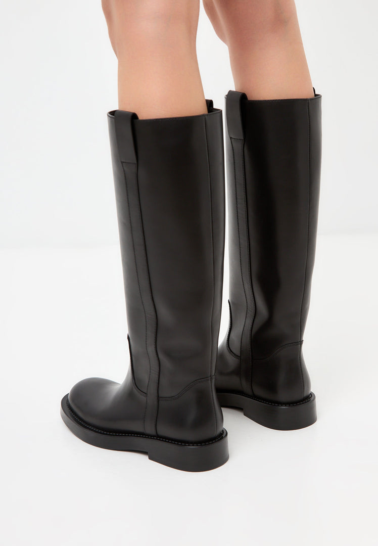 A pair of stylish Ari leather knee-high boots in classic black, perfect for women who want timeless and high-quality leather boots.