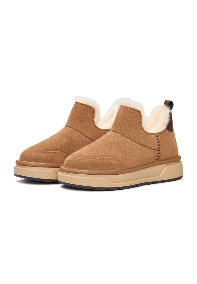 Stay cozy and chic all winter long with these stylish brown shearling boots, perfect for your Aspen getaway or everyday cold-weather look.