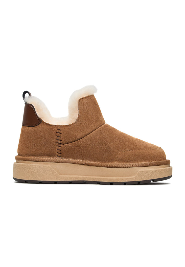 Stay cozy and stylish this winter with these brown shearling winter boots suitable for any Aspen adventure or casual outing.