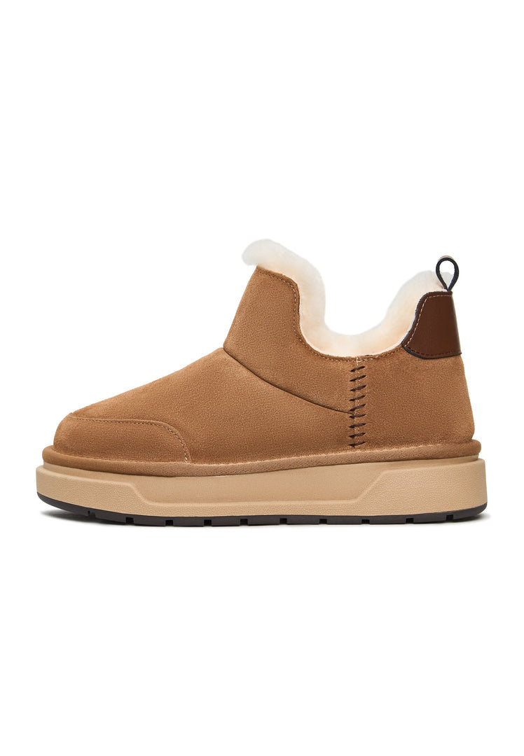 A pair of cozy brown shearling winter boots, perfect for staying warm and stylish in the cold weather of Aspen.