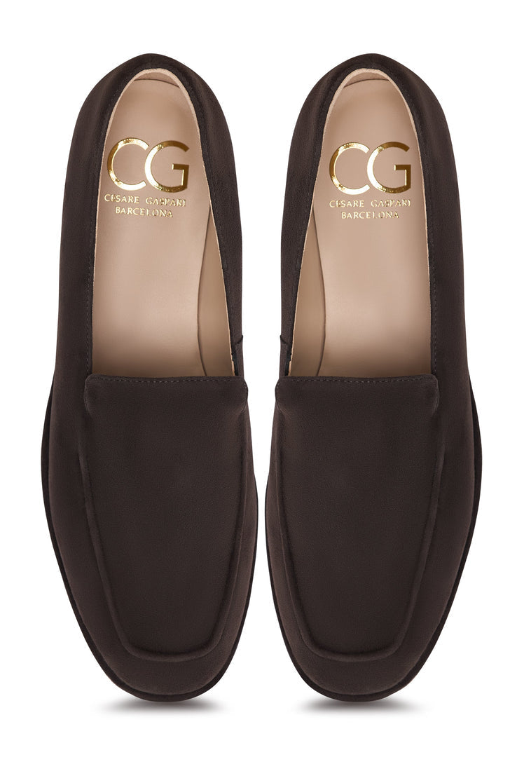 A stylish pair of brown suede loafers with a comfortable platform design, perfect for everyday wear from Clau.