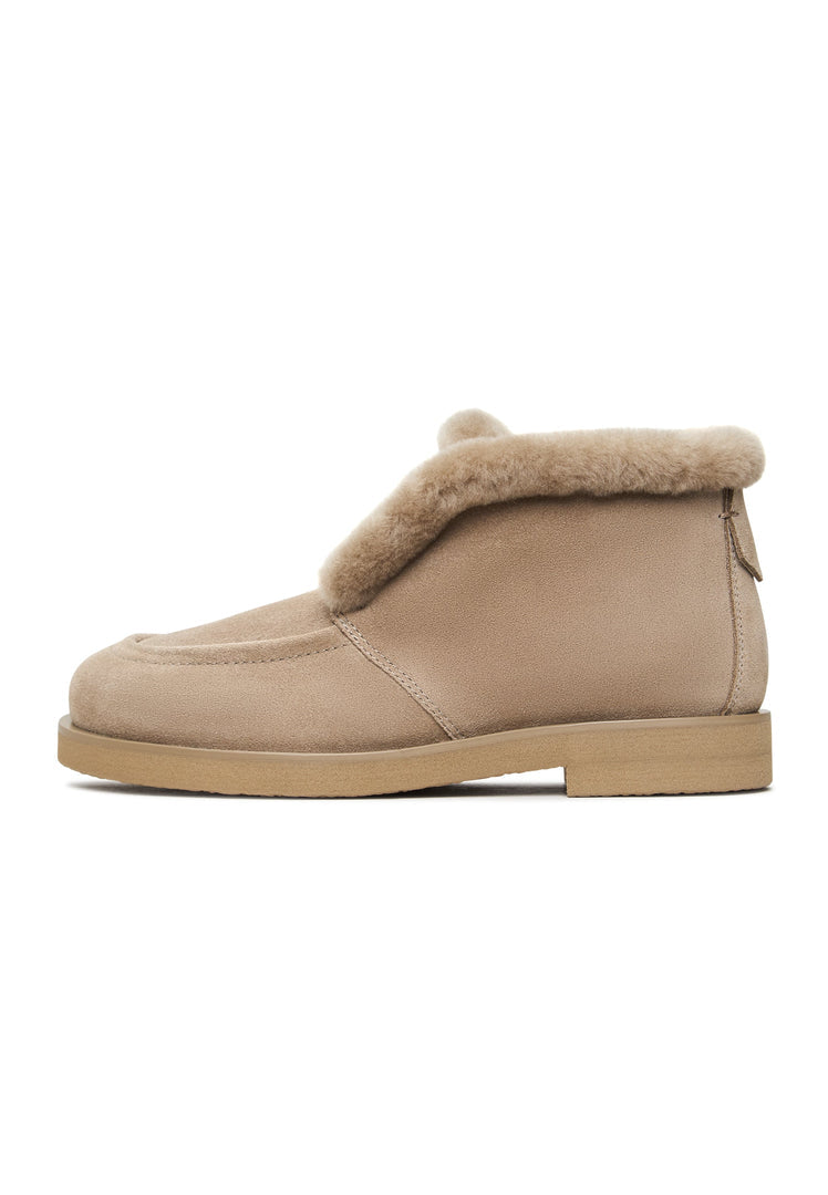 Stay warm and stylish this winter with Gerda beige suede fur-lined boots, the perfect cozy winter footwear for women.