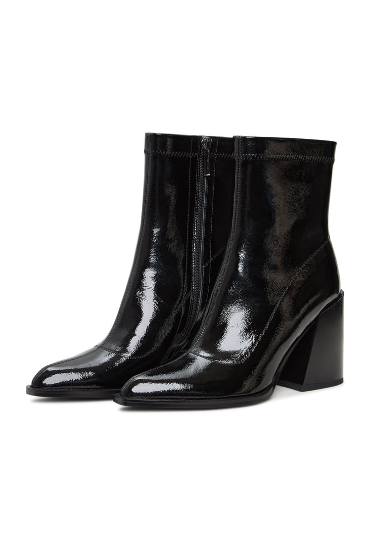 A stylish pair of Layla chunky heel leather block boots in patent black, perfect for any fashion-forward woman's collection.