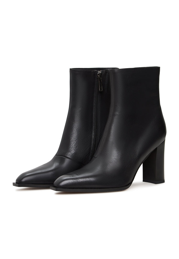 A stylish pair of women's black boots with a chic block heel design, known as Athena black boots, perfect for any fashionable outfit.