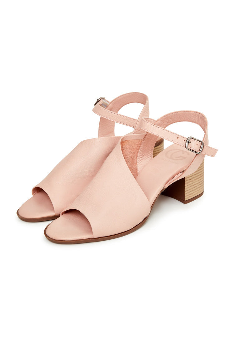 A stylish pair of women's pink leather block heel sandals, perfect for any occasion.