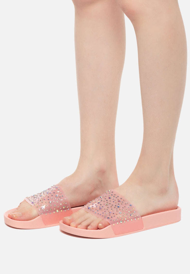 A stylish pair of pink thong flip flops, perfect for women's summer beach outings.
